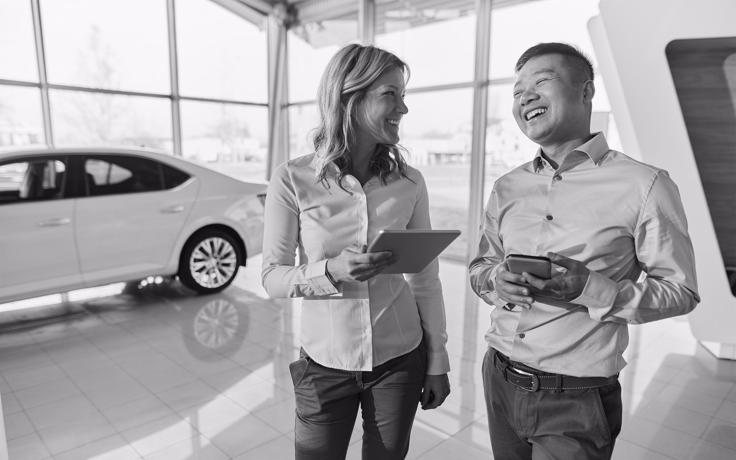 Woman And Man In Car Dealership